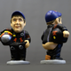 Image for article titled These Pooping F1 Driver Figurines Actually Have A Christmas Purpose